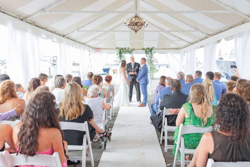 Waterfront wedding ceremony at Regatta Place in Newport, Rhode Island overlooking Newport Harbor.