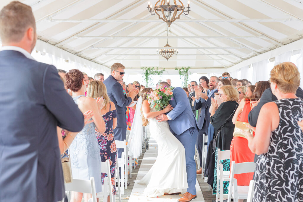 Bride and groom walking down the aisle after their Regatta Place wedding ceremony in Newport.