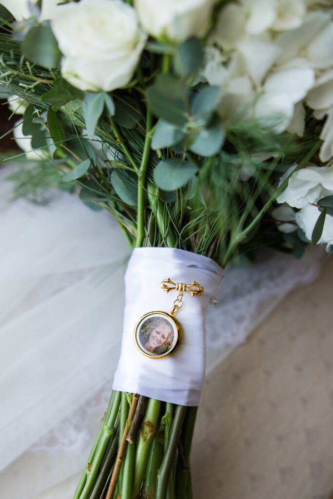 memorial photo charm attached to wedding bouquet