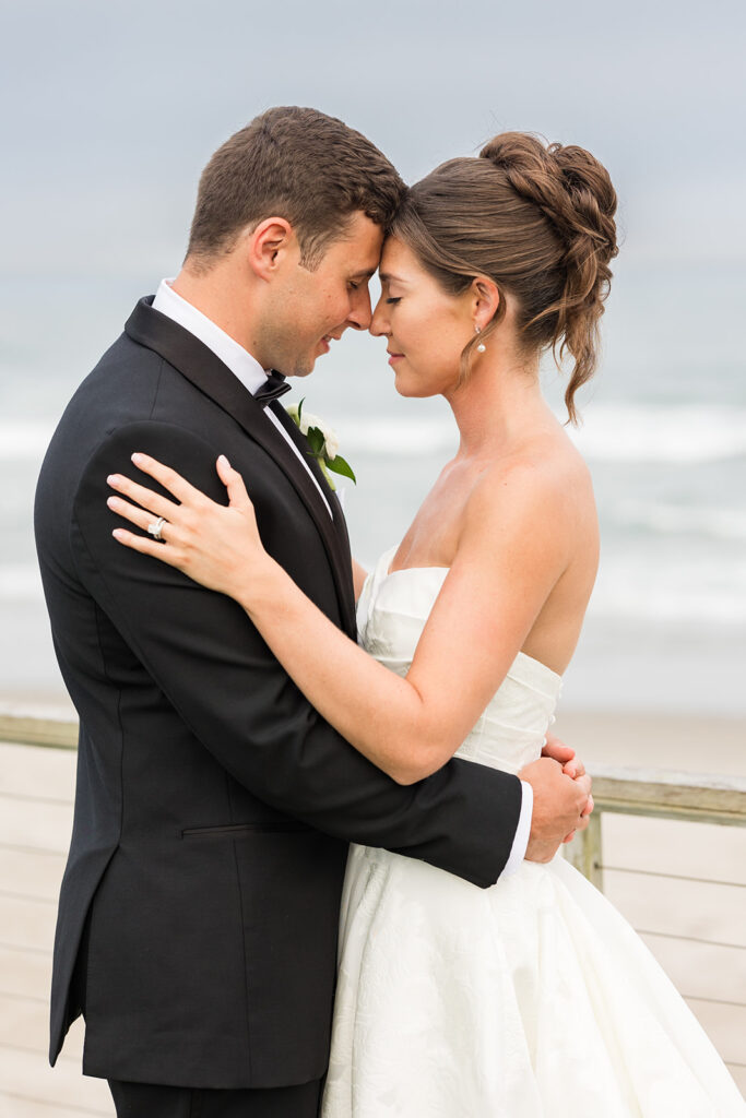 Elegant bridal updo hairstyle by Shelby White Beauty during beach wedding portrait