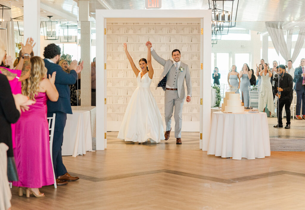 Bride and groom entering their reception at Newport Beach House in Middletown Rhode Island