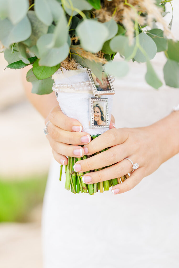 bridal bouquet with memorial photo charm honoring loved one during The Towers wedding in Narragansett Rhode Island