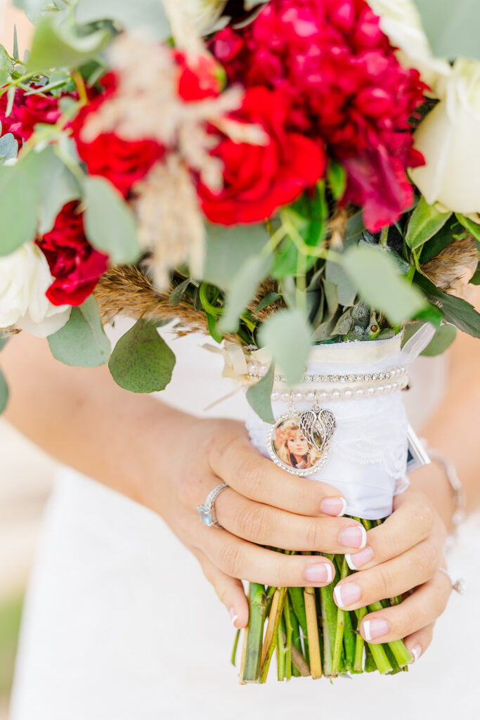 bridal bouquet with heart shaped memorial photo charm during Rhode Island wedding