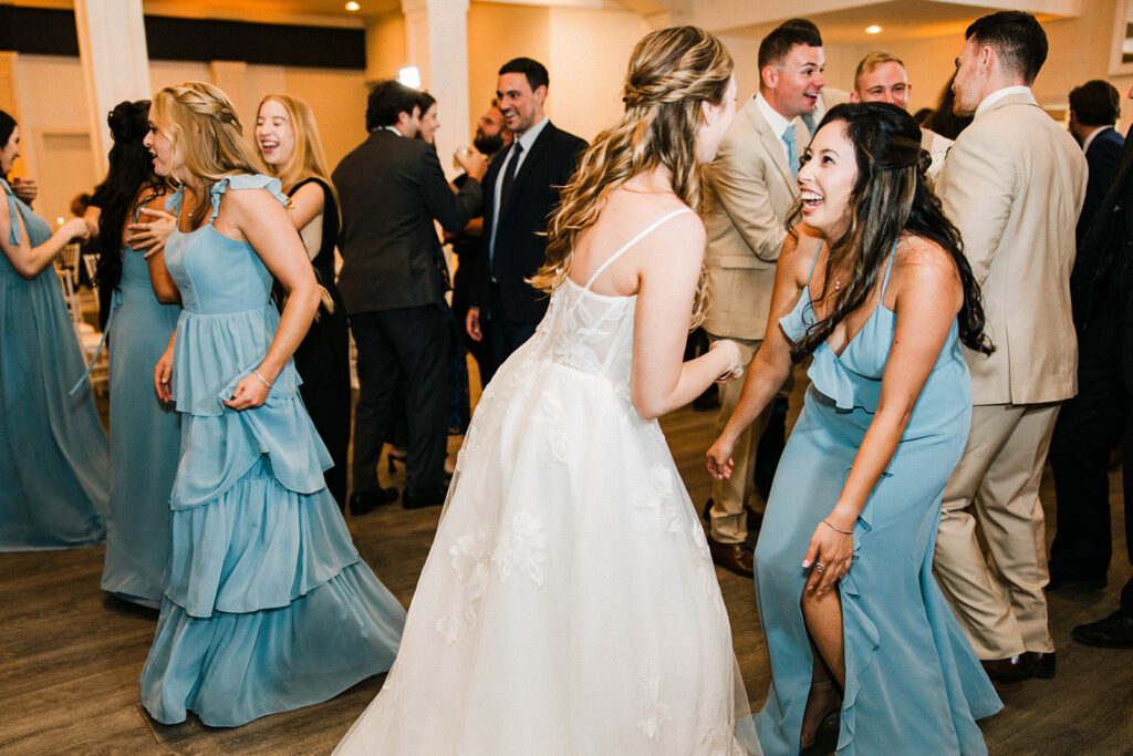 Bridesmaids dancing during Belle Mer wedding reception