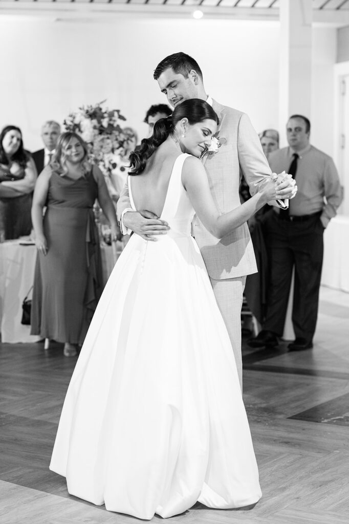 Bride and groom dancing with guests during Newport Beach House wedding reception