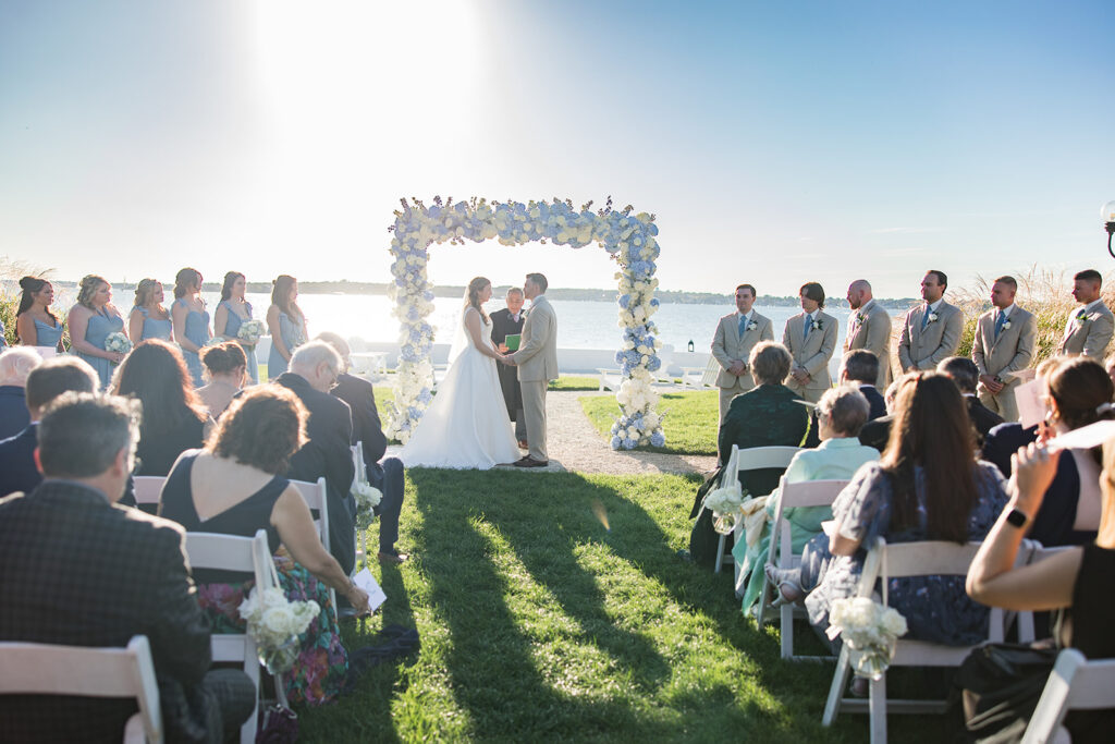 Waterfront wedding ceremony overlooking Narragansett Bay at Belle Mer in Newport Rhode Island