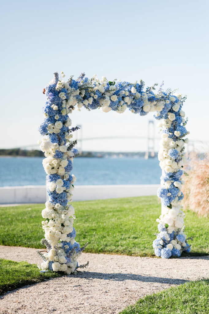 Floral ceremony arch by Sayles Livingston Design at Belle Mer wedding in Newport Rhode Island