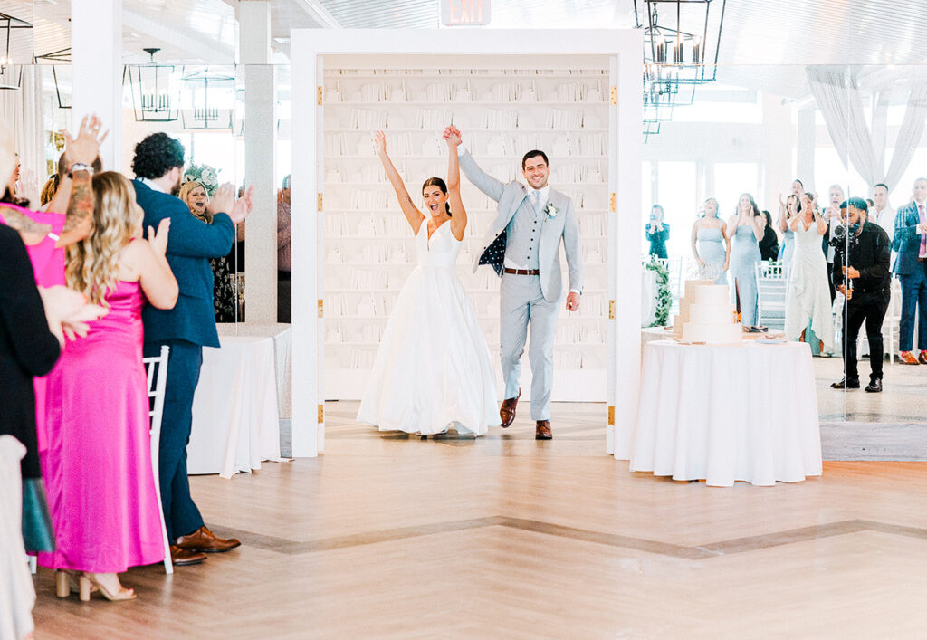 Bride and groom making their reception entrance at Newport Beach House in Newport Rhode Island