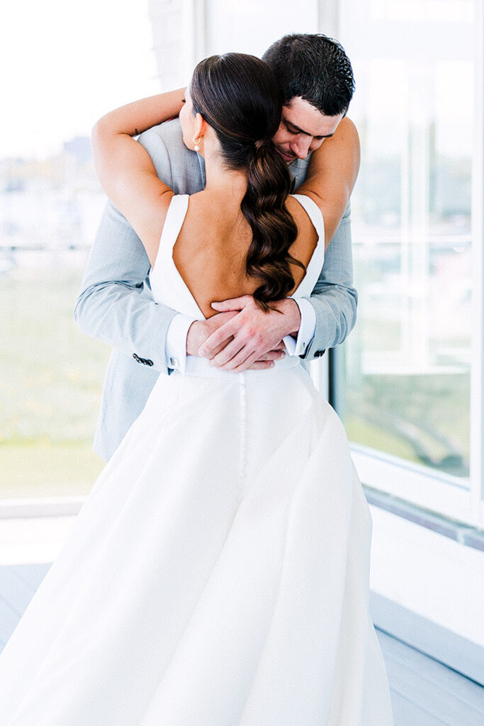 Bride and groom sharing an emotional first look before their Newport Rhode Island wedding
