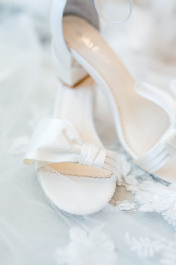Bridal shoes and accessories styled in soft natural light