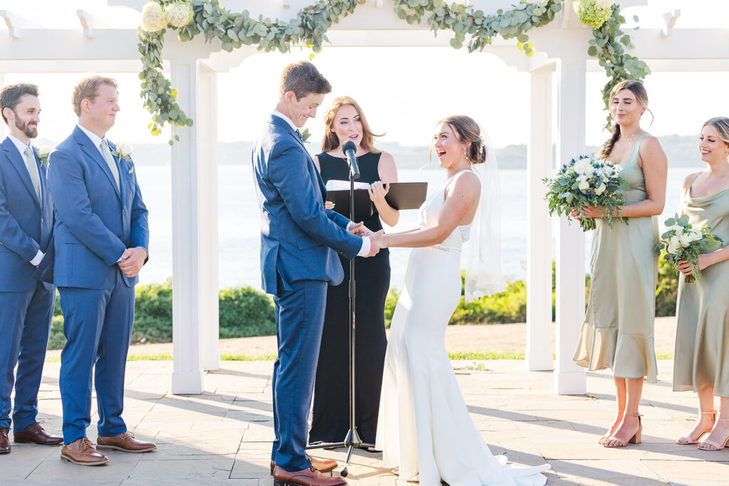 Newlyweds walking back down the aisle after their OceanCliff wedding ceremony