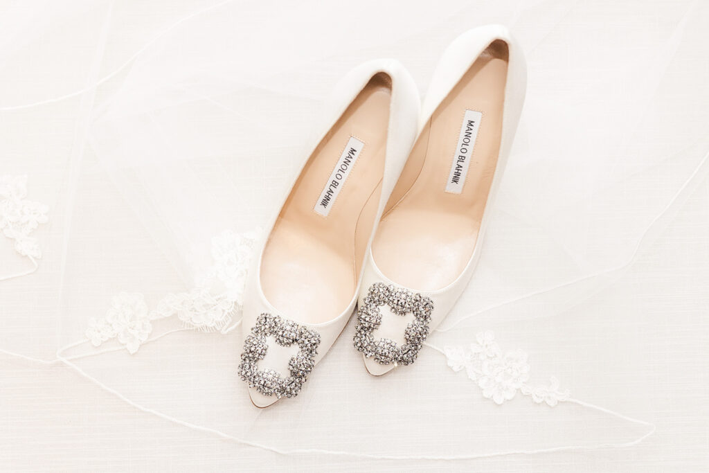 Bridal shoes photographed with wedding details at OceanCliff